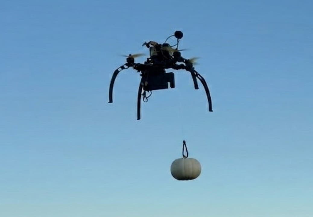 Thrax DropFlight payload delivery drone carrying package